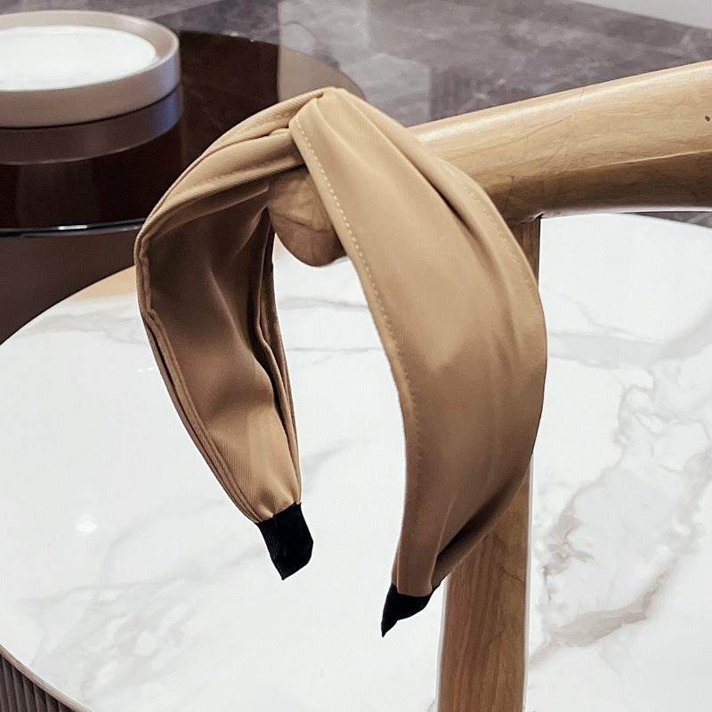 Fashionable Twisted Bow Headband for Polished Style