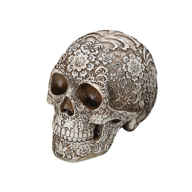Carved Skull Sculpture with Antique Floral Relief Decor
