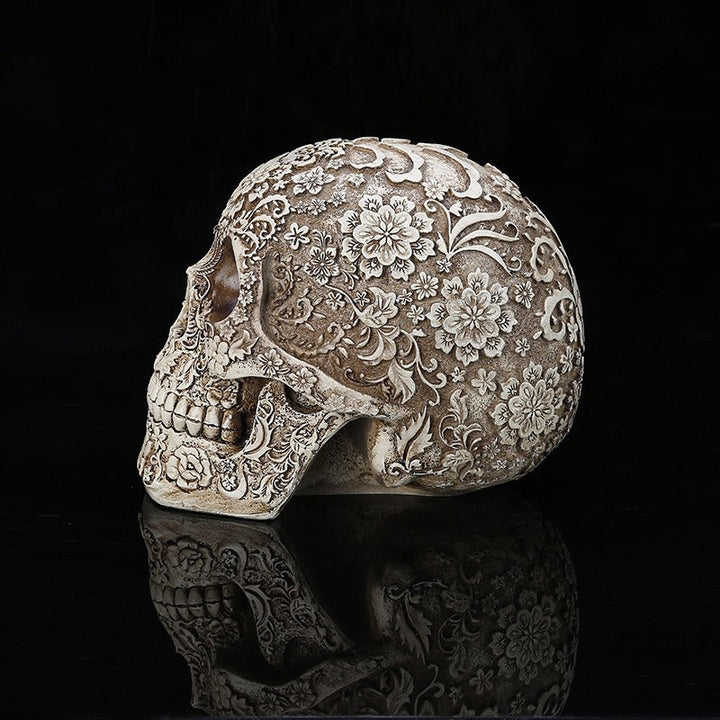 Carved Skull Sculpture with Antique Floral Relief Decor
