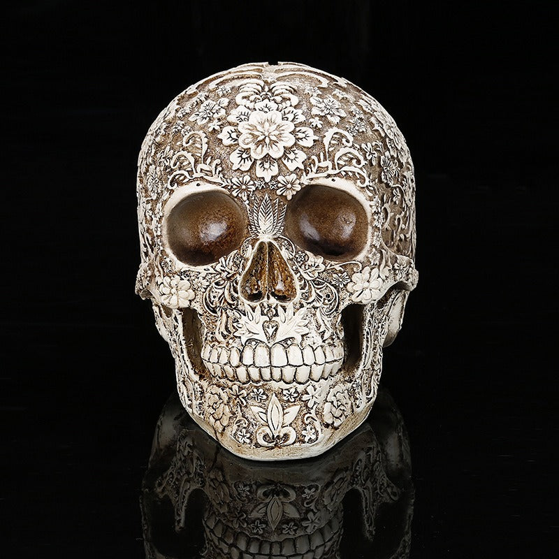Carved Skull Sculpture with Antique Floral Relief Decor
