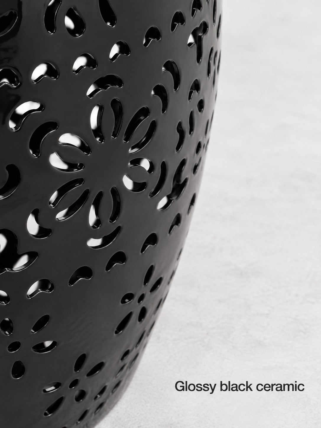 Black Ceramic Side Table with Floral Cutout Design