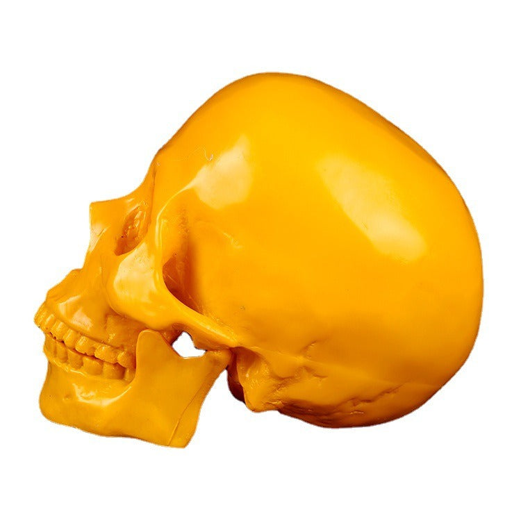 Yellow Resin Skull Ornament | Glossy Anatomical Decor