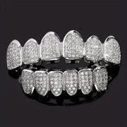 Close-up of a person wearing full silver CZ grillz on top and bottom teeth, with product flats showing both silver and gold colorways below