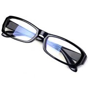 Black rectangular computer glasses with blue light filtering lenses shown at angle
