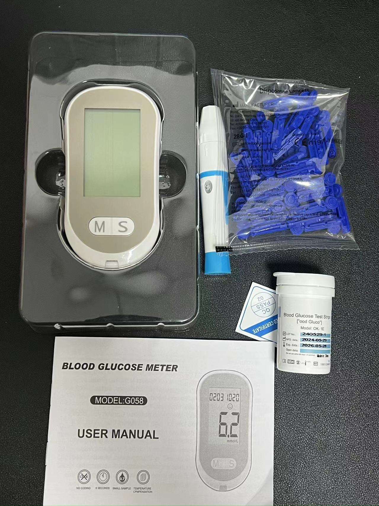 Flat lay of actual product in protective carrying case with disposable lancets package, lancing device, test strips bottle, and user manual booklet