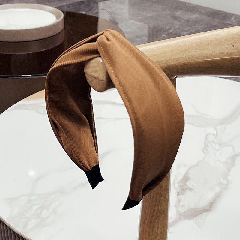 Fashionable Twisted Bow Headband for Polished Style