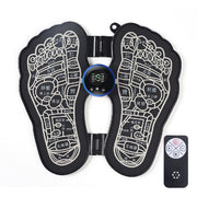 Black EMS foot massage mat showing both feet with detailed reflexology zone mapping, digital display center, and included wireless remote control