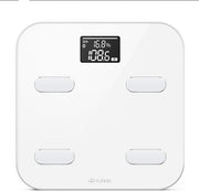 White smart scale displaying 16.8% body fat and 10.1 kg readings on black LCD screen