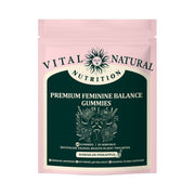 Front-facing pouch of Premium Feminine Balance Gummies in soft pink with forest green label panel featuring sun emblem and key benefit claims