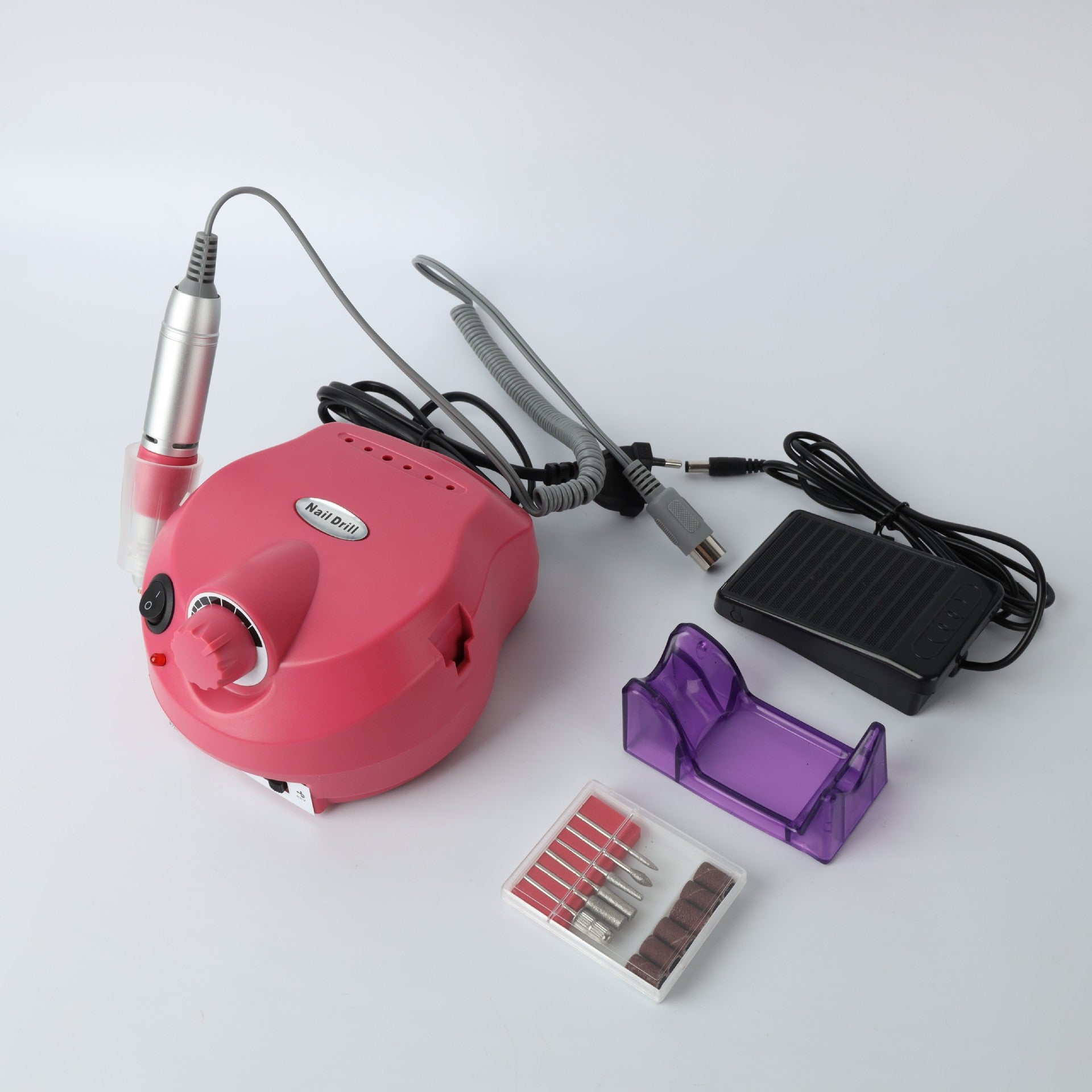 Complete nail grinder kit with pink machine, handpiece, power adapter, grinding bits, and organizer accessories