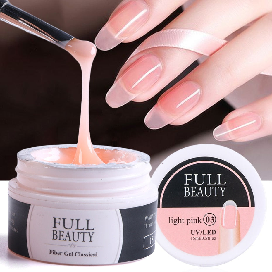 Light pink fiber gel in jar with brush demonstrating glossy application result on extended coffin nails with black accent lines