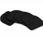 Four stacked dark foam anti-vibration pads displayed in graduated arrangement