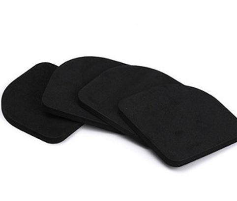Four stacked dark foam anti-vibration pads displayed in graduated arrangement