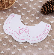 Product packaging showing three pairs of white adhesive nipple stickers with pink sizing/placement guides and brand label against neutral polka-dot background