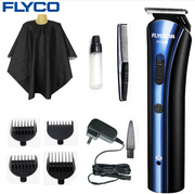 Complete FLYCO hair clipper kit with all accessories displayed: main unit, 4 limit combs, spray bottle, cleaning brush, power adapter, and barber cape