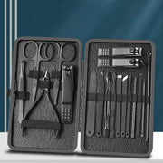 Open dual-case manicure set showing organized interior with multiple nail clippers, scissors, and grooming tools in mesh-lined compartments