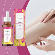 OceAura Cyperus Rotundus Oil dropper bottle and packaging box on vibrant pink gradient background with tropical leaf motifs