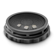 Top-angle view of assembled round black dental processing box with fine metal mesh screen and knurled grip base ring