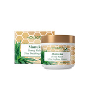 Product shot with packaging and jar of Houkea Manuka Honey Relief Ultra Soothing Cream against white background