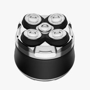 Top-down view of 5-point rotary shaver head with stainless steel cutting elements and black protective caps