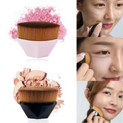 Two hexagonal makeup brushes with golden bristles and pink/black handles shown with powder swatches
