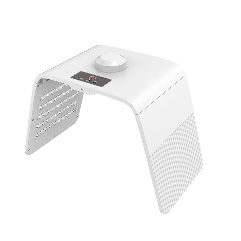 White foldable LED photon rejuvenation device shown from 3/4 angle with interior LED panel visible, digital display and rotary control