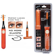Product display with mascara wand showing orange barrel, black bristles, and before/after lash comparison demonstrating clump-free results