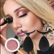 Woman applying rose pink eyeshadow with the stamp applicator, showing before product and two teardrop applicators with curved handles