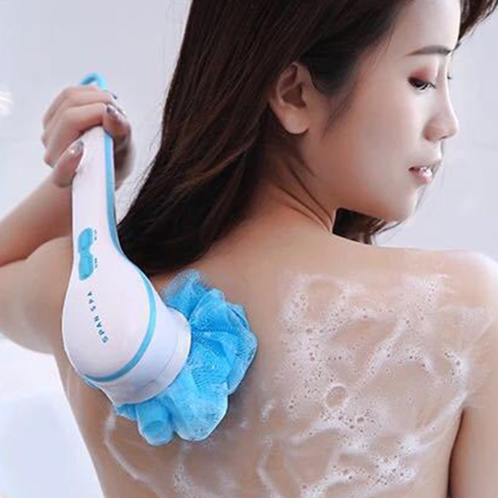 Woman using electric bath brush on back with blue loofah attachment, showing smooth exfoliated skin after use