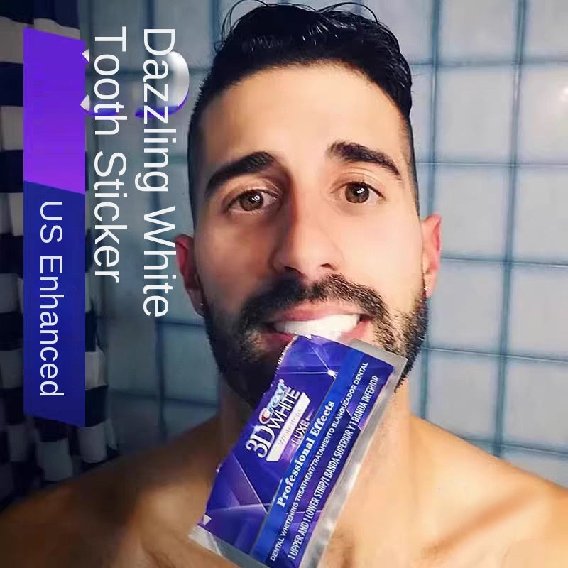 Male model with visibly whiter teeth holding Crest 3D White toothstick near mouth, smiling confidently