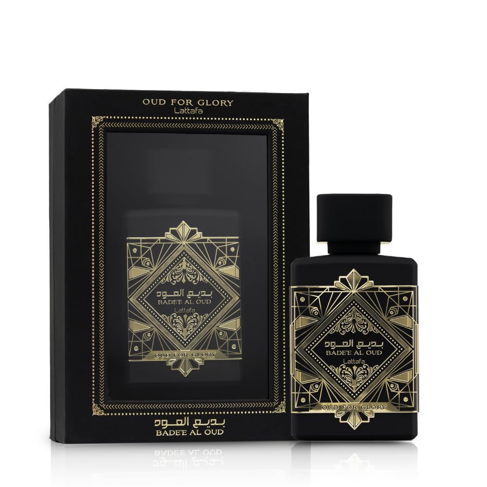 Lattafa Bade'e Al Oud Oud for Glory black and gold perfume bottle beside its matching black gift box on white background