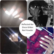 Close-up of nails painted with reflective disco glitter under bright light, showing intense mirror-like sparkle and reflective effect