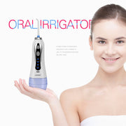 Young girl holding cordless oral irrigator with periwinkle base, smiling with clean healthy teeth; product positioned as safe and effective for children