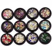 12-compartment collection of crystal stones organized by color in black containers