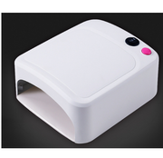 White compact UV lamp with hot pink and black control buttons on white background
