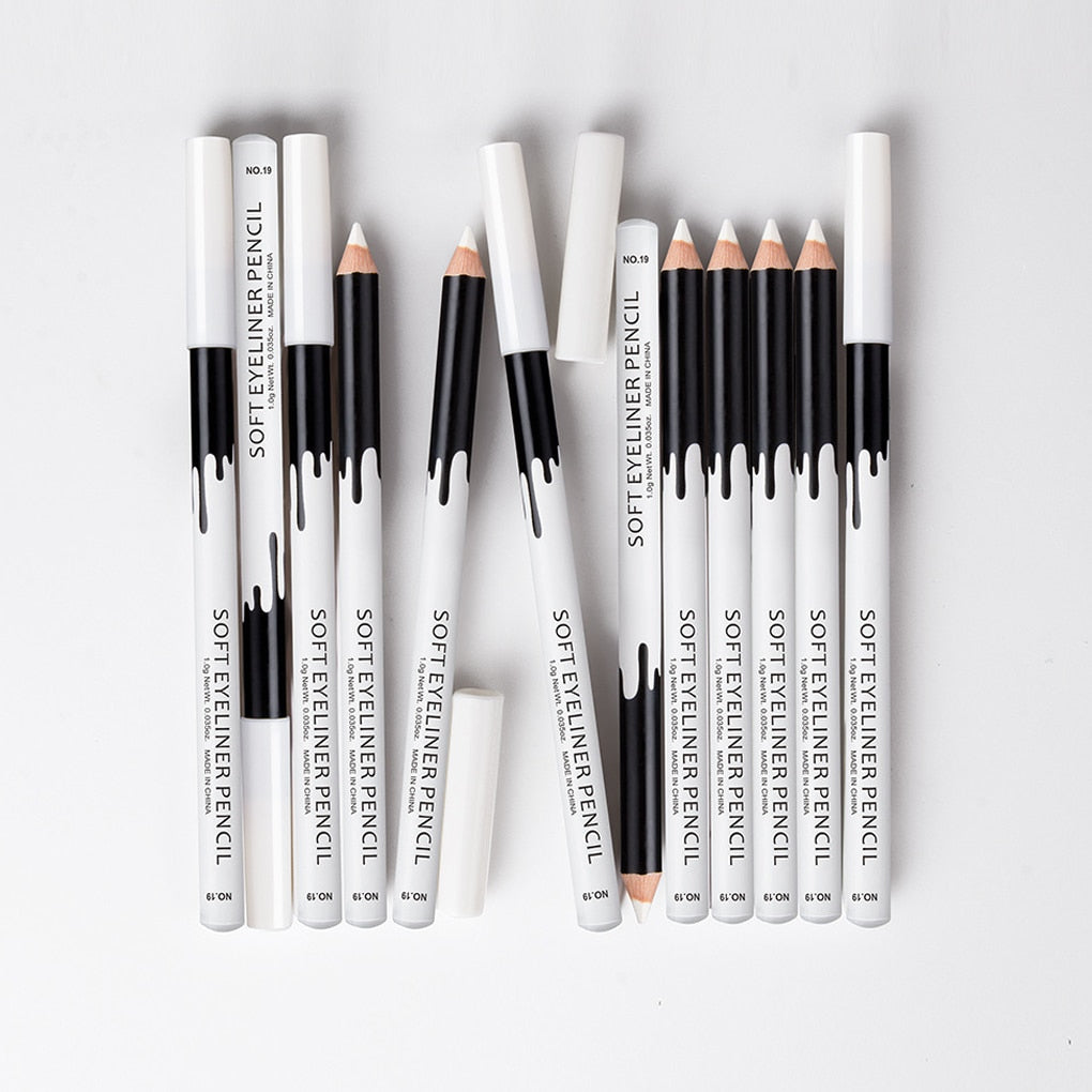 Extensive collection display of soft eyeliner pencils in various configurations with white and black packaging showing product lineup