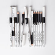 Extensive collection display of soft eyeliner pencils in various configurations with white and black packaging showing product lineup