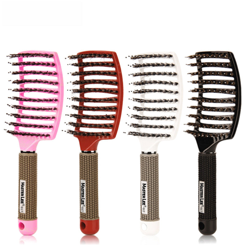Four hairbrushes in hot pink, burgundy, cream, and black displayed side by side showing color variety and design consistency