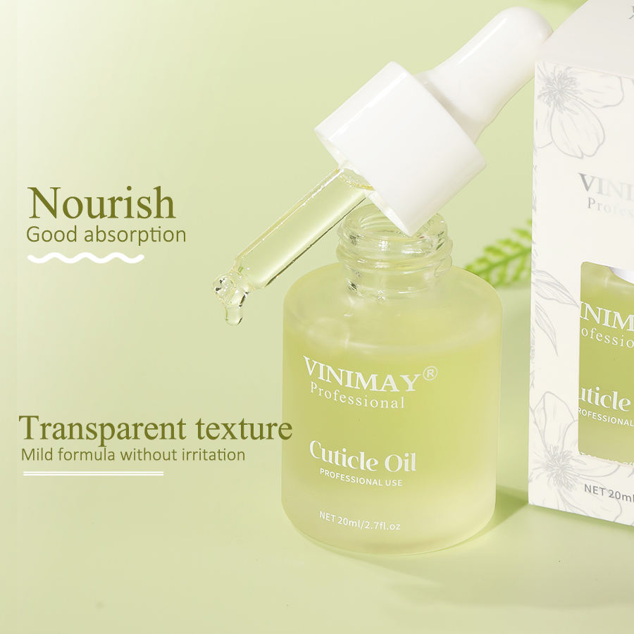 VINIMAX Cuticle Oil with dropper dispensing product, pale yellow formula on soft sage background with text 'Nourish Good absorption' and 'Transparent texture Mild formula without irritation'