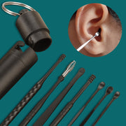 Complete ear cleaning kit display with case, multiple tools, and close-up ear demonstration