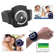 Anti-snoring wrist device shown on adjustable fabric strap with chrome ring and black casing displaying TEST button and Snore Stopper branding