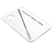 White acrylic makeup palette with gray spatula on light background showing text and circular mixing well