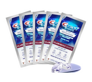 Crest 3D White Glamorous White Whitestrips with applicator tray showing 5 individual packets fanned out
