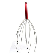 Red-handled scalp massager with stainless steel wire tines and rounded bead tips on white background