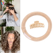 Woman demonstrating how to wrap hair around the beige foam curler ring, showing proper application technique