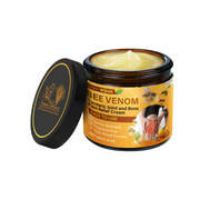 Product shot of bee venom turmeric cream in amber glass jar with black lid, showing pale yellow-cream texture inside