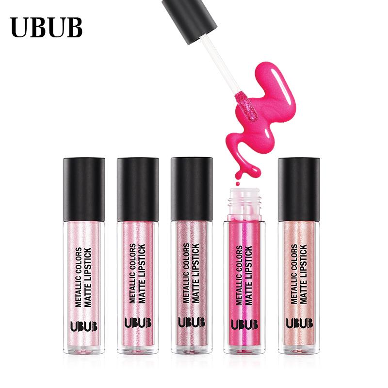 Full product lineup of 5 UBUB metallic liquid lipsticks in open bottles with wands, showing hot pink shade being applied