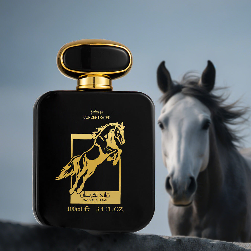 Black Qaed Al Fursan perfume bottle with gold horse logo and white horse in background
