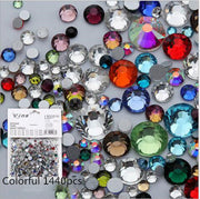 Four black nail polish samples displaying different HotFix crystal rhinestone designs with assorted gemstone colors
