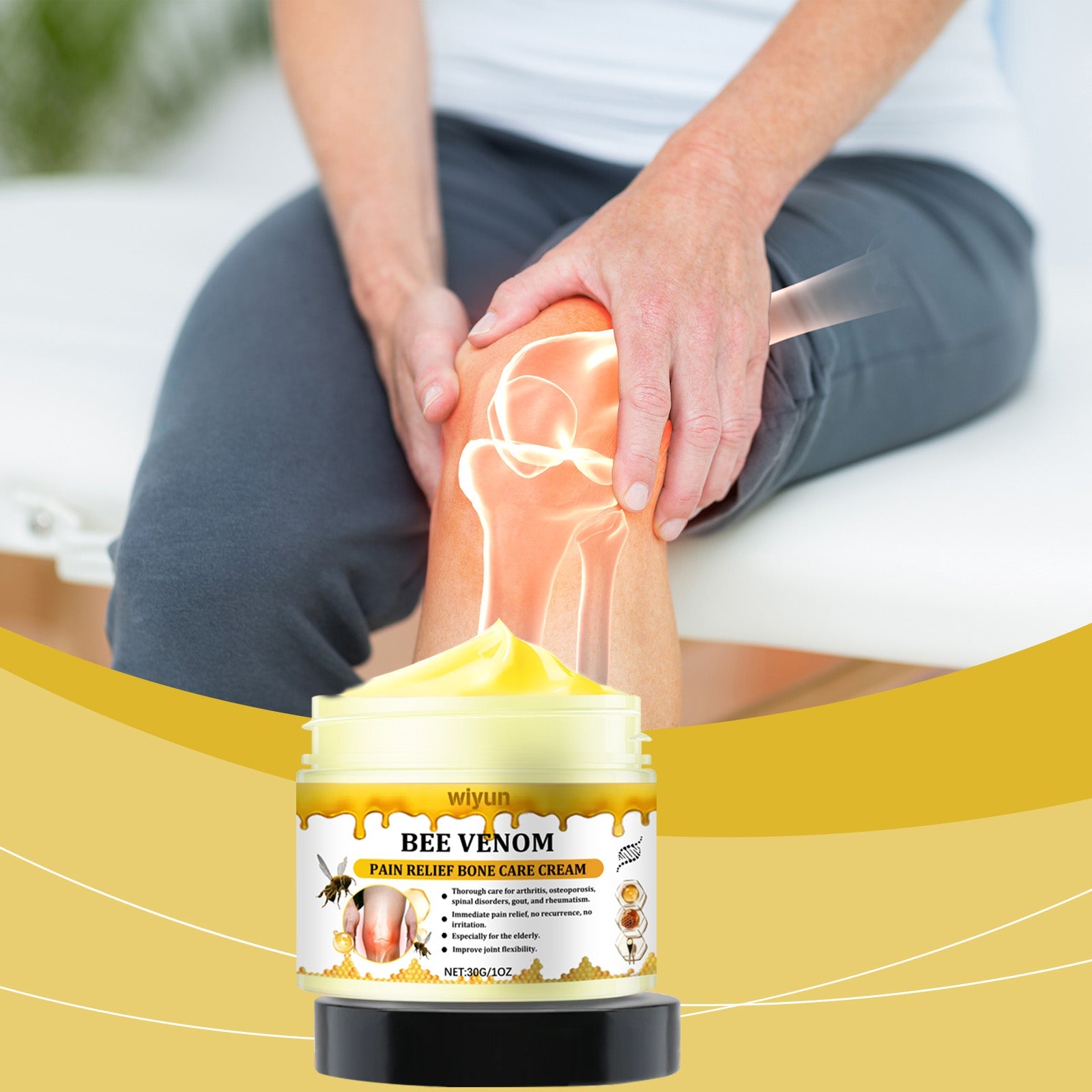 Athlete's hands massaging cream into knee during active recovery outdoors with yellow brand wave accent